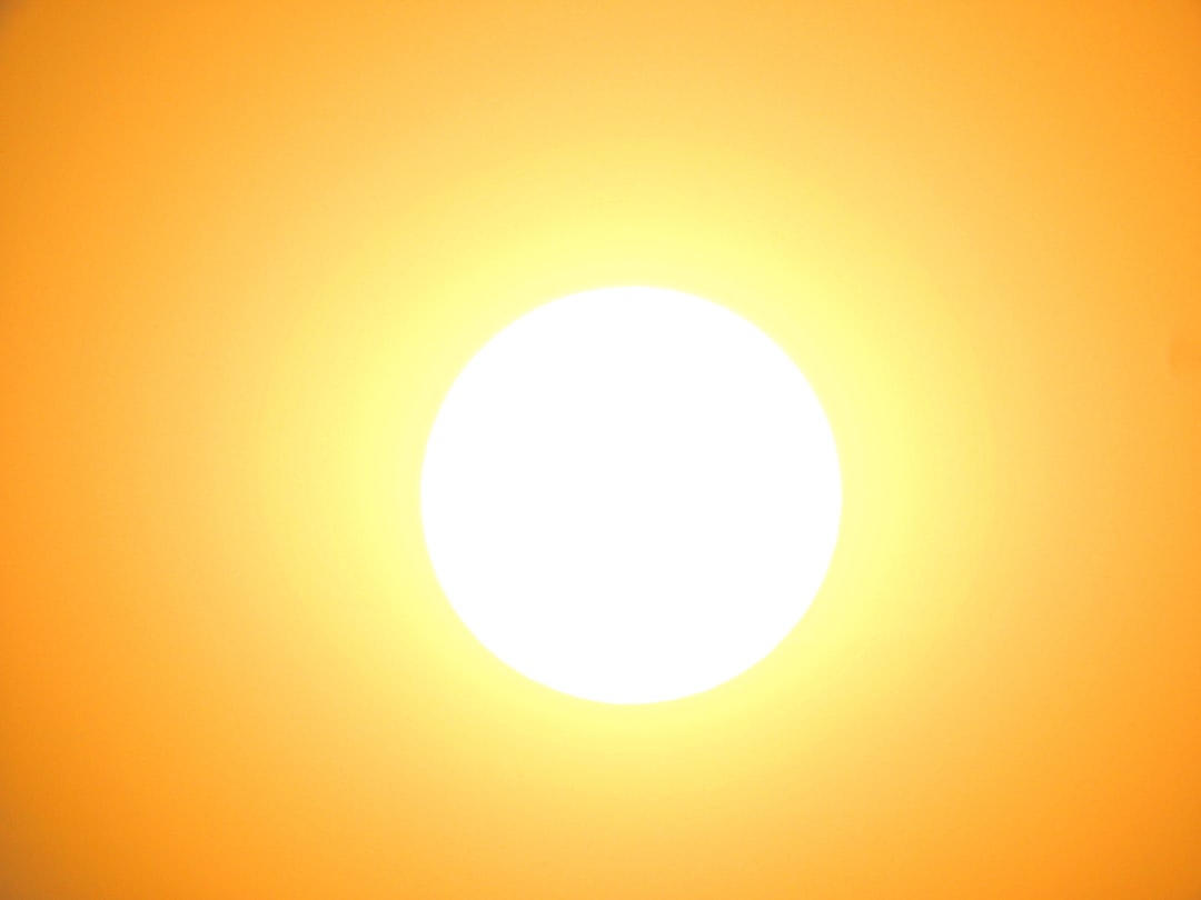 Solar panels in bright summer sunshine on a rooftop