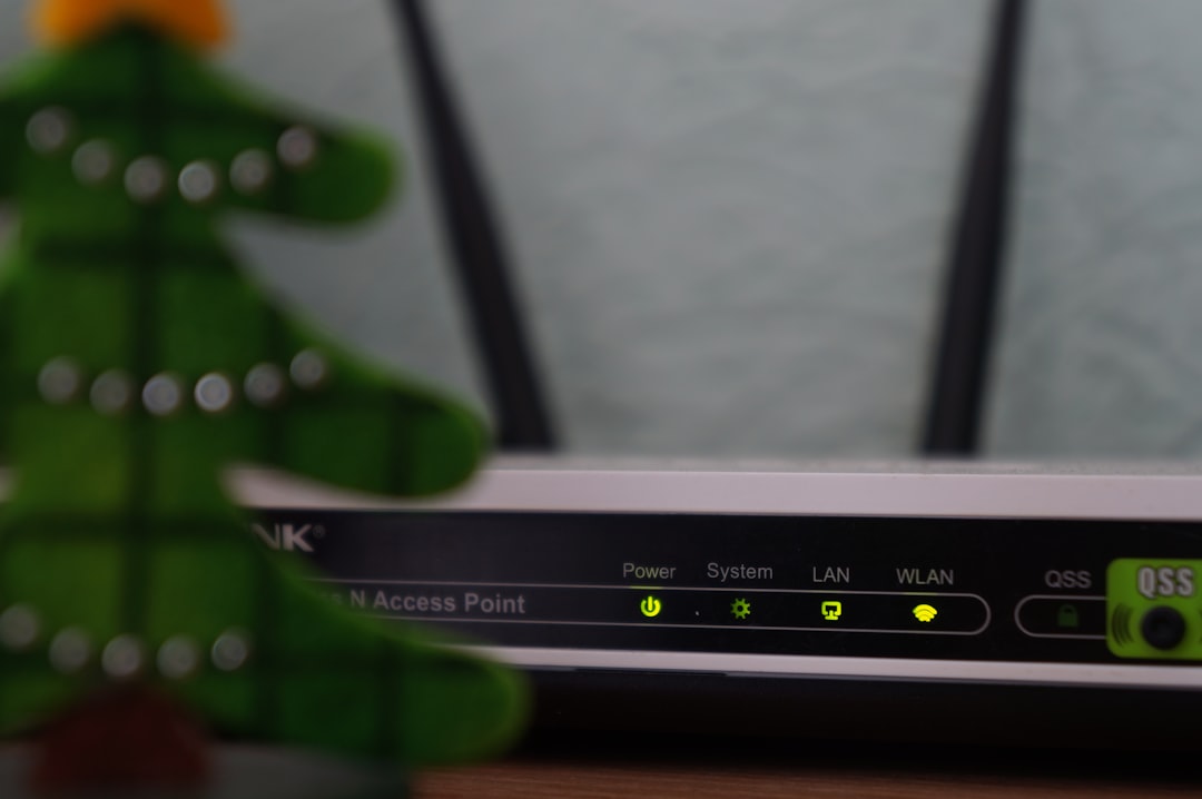 Close-up of a WiFi router with signal lights glowing